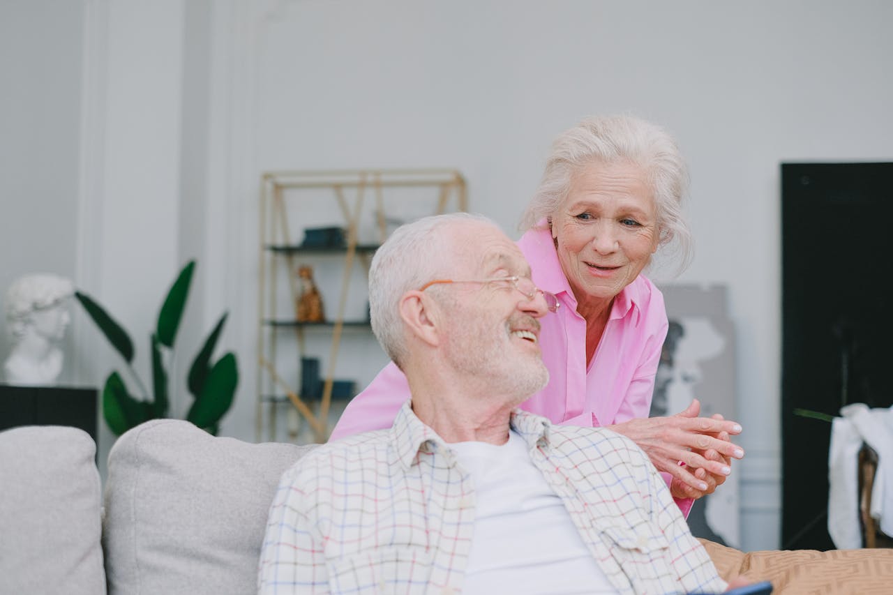 Crafting Captivating Headlines: Your awesome post title goes here Smiling elderly couple sharing a moment of togetherness at home, emphasizing love and happiness.